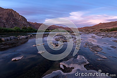 A long exposure landscape taken after sunset on the Orange River Stock Photo