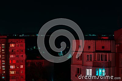 Long exposure photo of high-rise buildings in red and blue lights. Night cityscape. Big city life Stock Photo