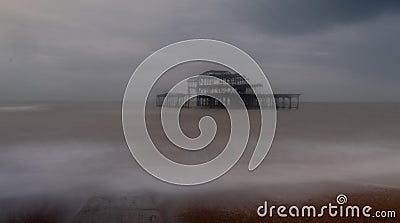 Long exposure photograph of the ruins of West Pier, Brighton Sussex UK on a cold, stormy winter`s day. Stock Photo