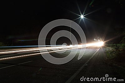 Long exposure photography of a highway with light trailing and street light Stock Photo