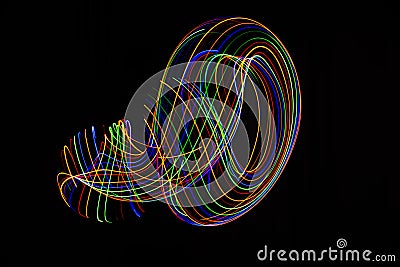 Long exposure photography made with light paint of various colors on a black background, waves, curves and swirls, curvilinear or Stock Photo