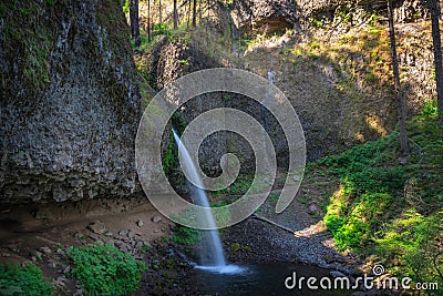 Long exposure of Ponytail Falls also known as Upper Horsetail Falls Stock Photo