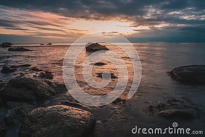 Long exposure of sea and rocks. sunset time Stock Photo