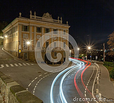 Long exposure shot of car light trails on a road near the Palazzo Medolago Albani Stock Photo