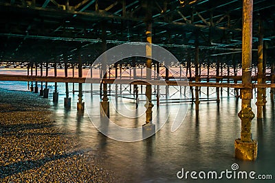 Long exposure shot of structural supports under pier Stock Photo