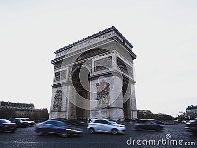 Long exposure street panorama of Arc de Triomphe Etoile monument traffic Champs Elysees Paris France Europe Editorial Stock Photo