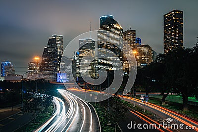 Long exposure of traffic on Allen Parkway and the Houston skyline at night, in Houston, Texas Stock Photo