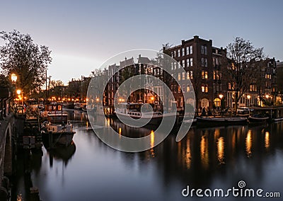 After sunset glow and canal reflections in Amsterdam Stock Photo