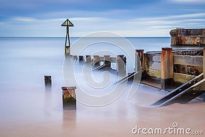 Long Exposure of Waymarker at Seaton Sluice harbour entrance Stock Photo