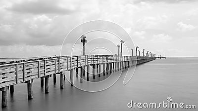 Wooden fishing pier in La Porter, Texas, USA in long exposure, b Stock Photo