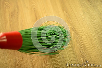 Long green plastic broom. Stock Photo