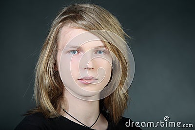 Long hair boy in photo studio Stock Photo