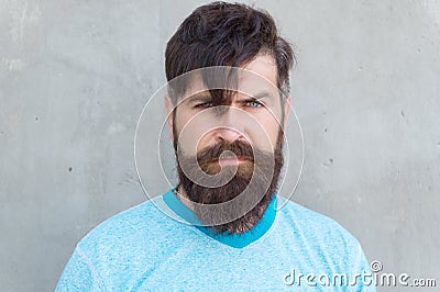 Long hair. Cut bangs. Cool hipster with beard need haircut. Barber salon and facial care. Hipster lifestyle. Brutal Stock Photo