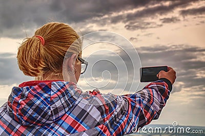 Long hair cute girl take picture by smart phone Stock Photo