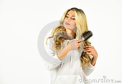 Long hair. Hair care. Hairdresser salon. Easy hairdo. Beauty supplies. Bristles perfectly untangle curly hair. Hot Stock Photo