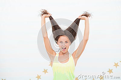 Long hair will always be on trend. Happy girl hold long hair. Trendy long hairstyle. Long hair growth stimulant. Natural Stock Photo