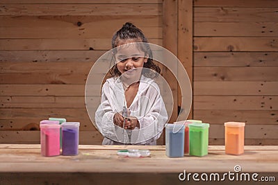 A long haired boys are enjoying using an air pump Stock Photo