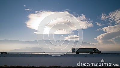 Long Haul Over the Road Freight Trucking Winter Highway Stock Photo