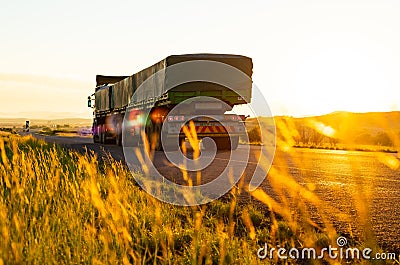 Long Haul overnight Trucking Logistics on a country highway road in South African Farmland region Editorial Stock Photo