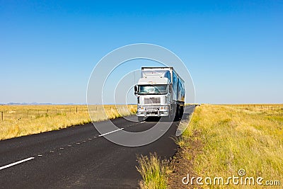 Long Haul overnight Trucking Logistics on a country highway road in South African Farmland region Editorial Stock Photo