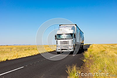 Long Haul overnight Trucking Logistics on a country highway road in South African Farmland region Editorial Stock Photo