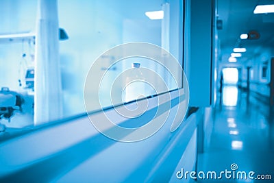 Long hospital hallway with observation window to the ward Stock Photo