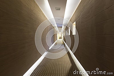 Long hotel corridor with modern floor and ceiling lights Stock Photo