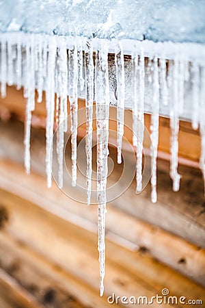 Long Icicles Melting of a roof top Stock Photo