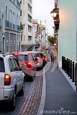 Long line of cars on narrow street in San Juan Puerto Rico Stock Photo