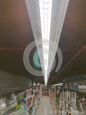 Long line of ceiling tube lights Stock Photo
