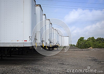 Long line of empty unused trailers waiting for work in Texas Stock Photo