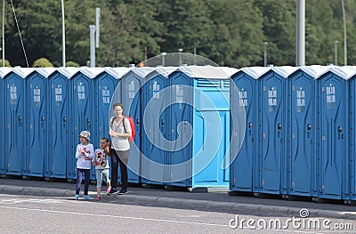 A long line of portable toilets in an outdoor event Editorial Stock Photo