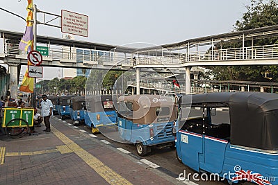 A long line of tuk tuk waiting for new customers in Dr Sutomo Street. Editorial Stock Photo