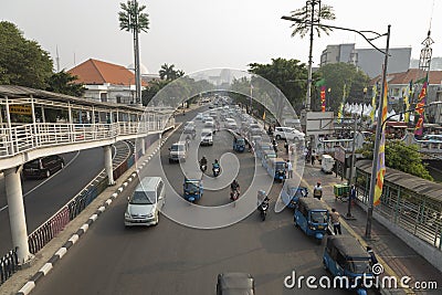 A long line of tuk tuk waiting for new customers in Dr Sutomo Street. Editorial Stock Photo