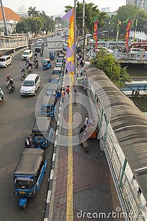 A long line of tuk tuk waiting for new customers in Dr Sutomo Street. Editorial Stock Photo