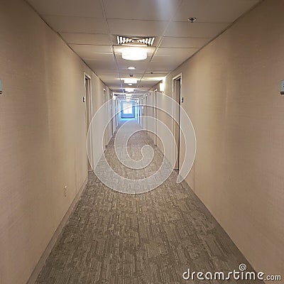 Long motel hallways carpet beige Stock Photo