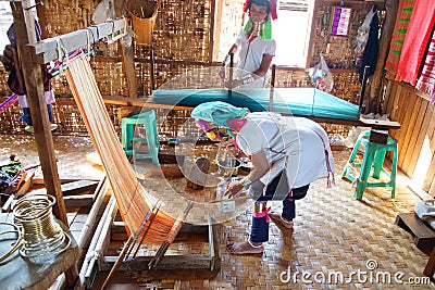 Long necked Kayan Padaung woman weaving Editorial Stock Photo