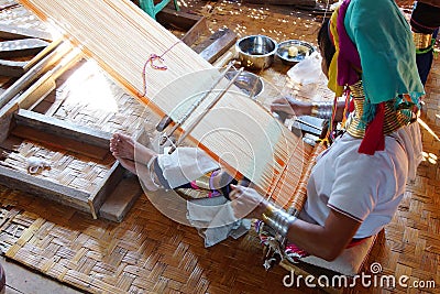 Long necked Kayan Padaung woman weaving Editorial Stock Photo
