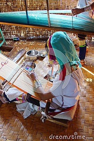 Long necked Kayan Padaung woman weaving Editorial Stock Photo