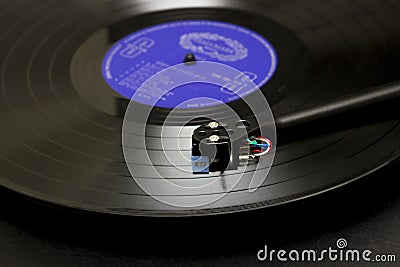 A Long play vinyl record on a turntable with tone arm and cartridge in Bangor County down in Northern Ireland Editorial Stock Photo