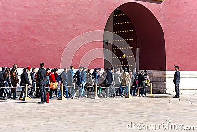 Long queue of tourists are waiting for passing throught the Tiananmen gate and entering the Forbidden City in Beijing, China Editorial Stock Photo