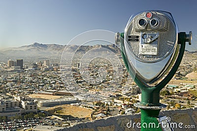 Long range binoculars for tourists and panoramic view of skyline and downtown of El Paso Texas looking toward Juarez, Mexico Editorial Stock Photo