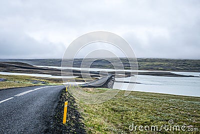 Long road crossing the famous Mossy lava field, Iceland Stock Photo