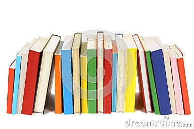 Long row of colorful library books isolated on white background Stock Photo