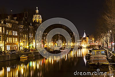 Long row of houses reflecting in a canal in Amsterdam Editorial Stock Photo