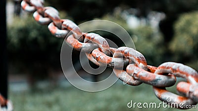 The long Rusty chains in park Stock Photo