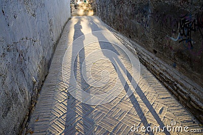 Long shadows of man and woman. Editorial Stock Photo