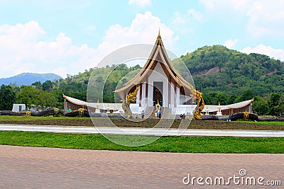 Long shot of a beautiful white Buddhist temple with dragon fountains at Ban Nong Chaeng, Phetchabun Thailand. Editorial Stock Photo