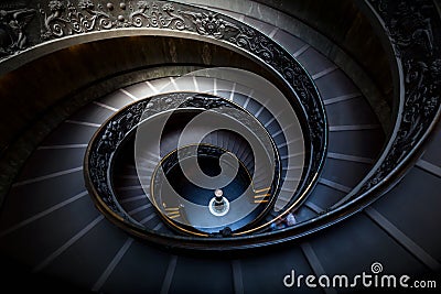 Long spiral, winding stairs. Dark shadows, soft light. Editorial Stock Photo