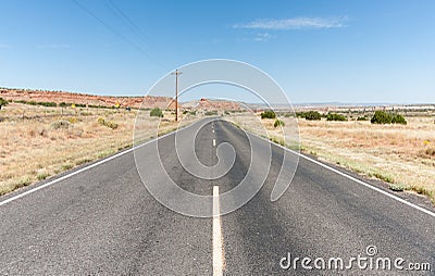 Long straight road ahead through desert of New Mexico, USA. Stock Photo